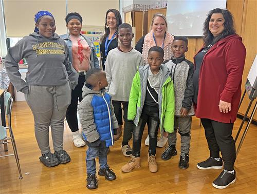 Family from Congo poses with Hoover Middle Staff